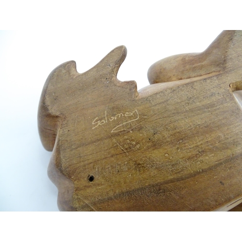 1134 - A pair of late 20thC carved wooden models of frogs / toads. Both signed Solomon under. Approx. 7