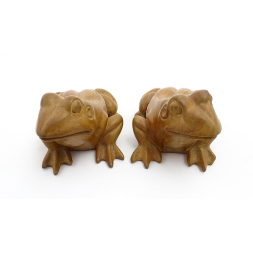 1134 - A pair of late 20thC carved wooden models of frogs / toads. Both signed Solomon under. Approx. 7