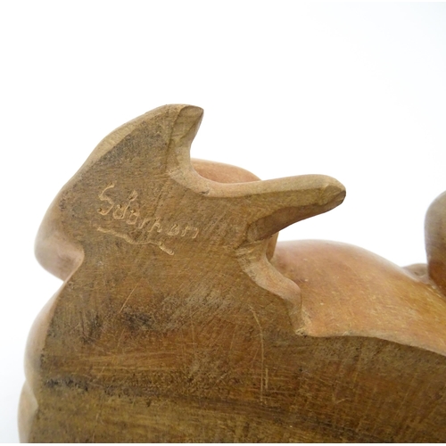 1134 - A pair of late 20thC carved wooden models of frogs / toads. Both signed Solomon under. Approx. 7