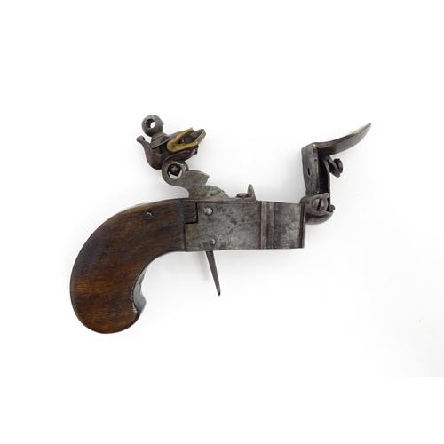 1195 - A 19thC tinder box lighter in the form of a flintlock pocket pistol, the lock with folding trigger, ... 