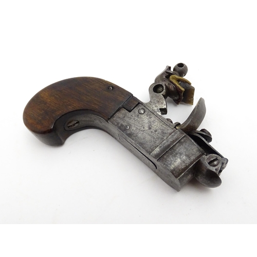 1195 - A 19thC tinder box lighter in the form of a flintlock pocket pistol, the lock with folding trigger, ... 