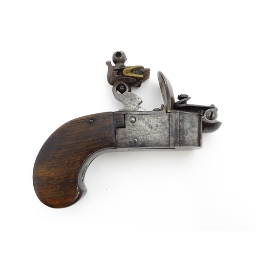 1195 - A 19thC tinder box lighter in the form of a flintlock pocket pistol, the lock with folding trigger, ... 