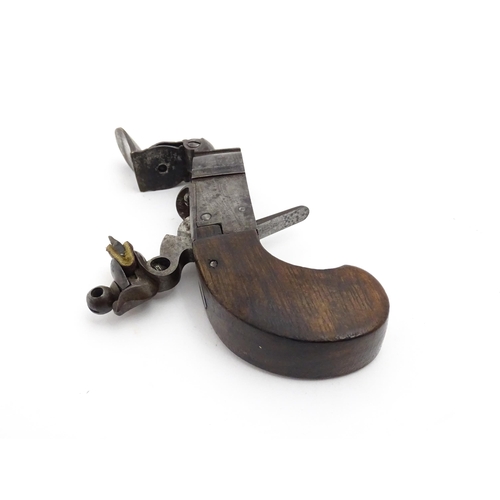 1195 - A 19thC tinder box lighter in the form of a flintlock pocket pistol, the lock with folding trigger, ... 