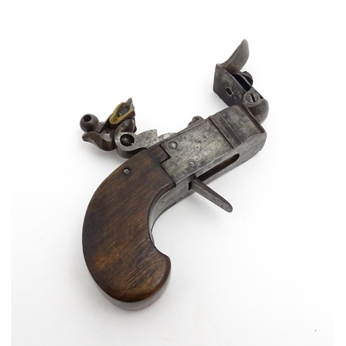 1195 - A 19thC tinder box lighter in the form of a flintlock pocket pistol, the lock with folding trigger, ... 