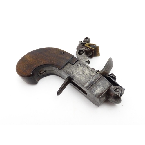 1195 - A 19thC tinder box lighter in the form of a flintlock pocket pistol, the lock with folding trigger, ... 