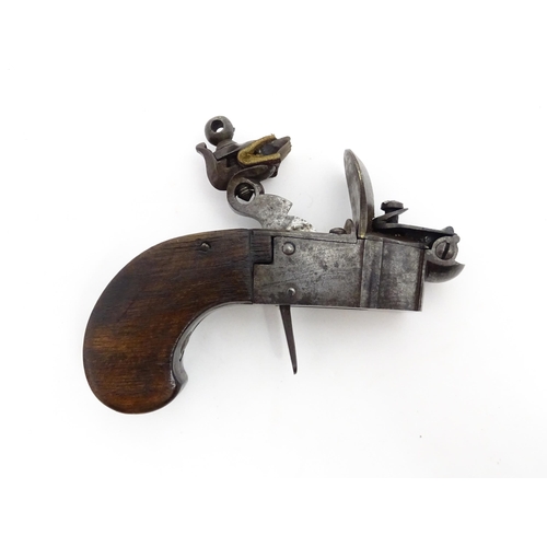 1195 - A 19thC tinder box lighter in the form of a flintlock pocket pistol, the lock with folding trigger, ... 