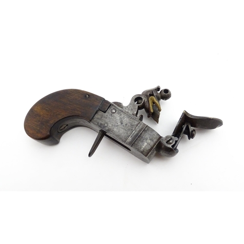 1195 - A 19thC tinder box lighter in the form of a flintlock pocket pistol, the lock with folding trigger, ... 