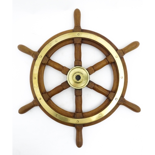 1245 - Nautical / Maritime Interest: A 20thC hardwood ship's wheel with six spokes and brass mounts. Approx... 