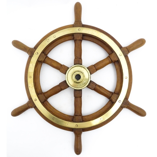 1245 - Nautical / Maritime Interest: A 20thC hardwood ship's wheel with six spokes and brass mounts. Approx... 