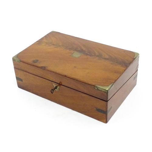 1248 - A 19thC brass bound mahogany writing slope opening to reveal a fitted interior. Approx. 5