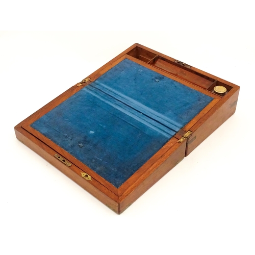 1248 - A 19thC brass bound mahogany writing slope opening to reveal a fitted interior. Approx. 5