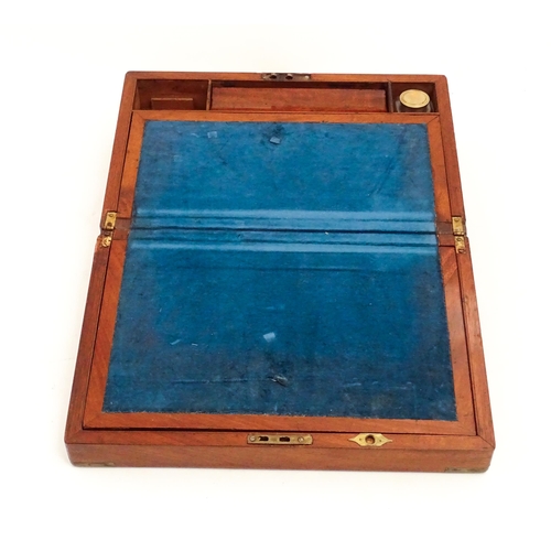 1248 - A 19thC brass bound mahogany writing slope opening to reveal a fitted interior. Approx. 5