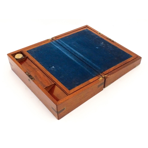 1248 - A 19thC brass bound mahogany writing slope opening to reveal a fitted interior. Approx. 5