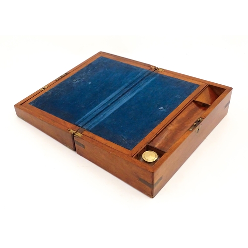 1248 - A 19thC brass bound mahogany writing slope opening to reveal a fitted interior. Approx. 5