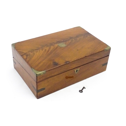 1248 - A 19thC brass bound mahogany writing slope opening to reveal a fitted interior. Approx. 5