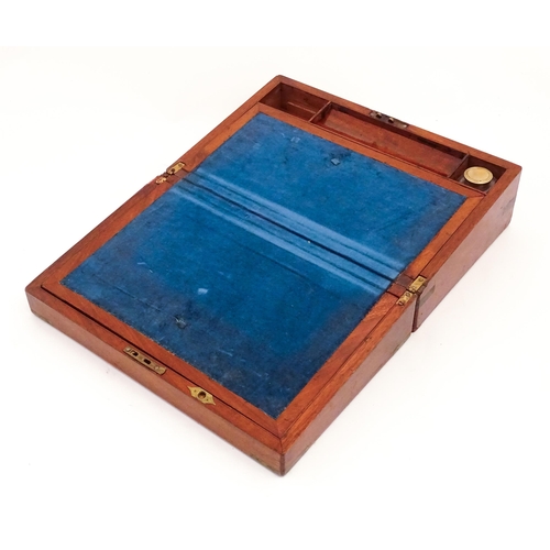 1248 - A 19thC brass bound mahogany writing slope opening to reveal a fitted interior. Approx. 5