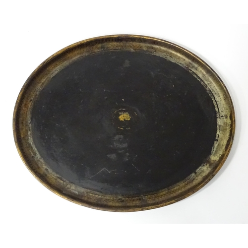 1252 - A Victorian toleware tray of oval form with gilt detail. Approx. 24