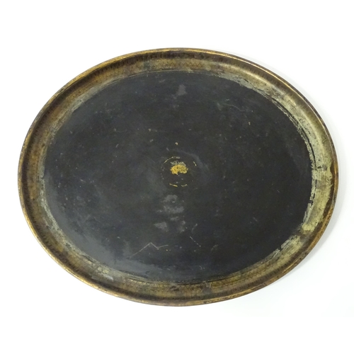 1252 - A Victorian toleware tray of oval form with gilt detail. Approx. 24