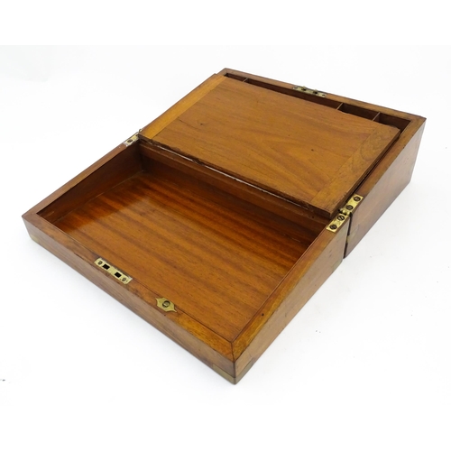 1256 - A Victorian walnut writing slope with brass mounts, the escutcheon dated 1898, opening to reveal a f... 