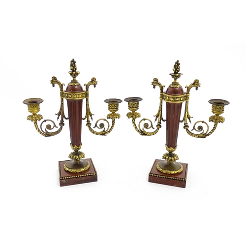 1264 - A pair of Continental 19thC marble and gilt metal twin branch candelabra / garnitures, the scrolling... 