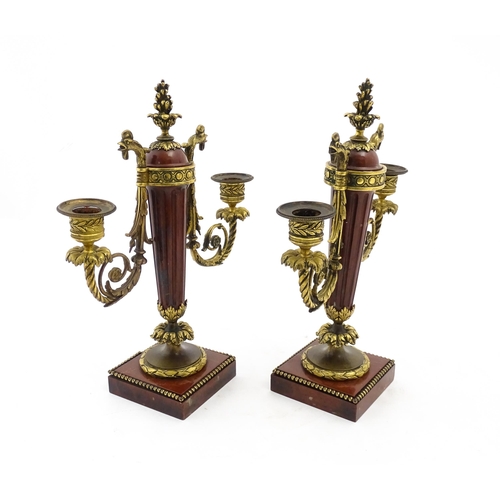 1264 - A pair of Continental 19thC marble and gilt metal twin branch candelabra / garnitures, the scrolling... 