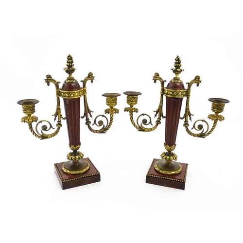 1264 - A pair of Continental 19thC marble and gilt metal twin branch candelabra / garnitures, the scrolling... 