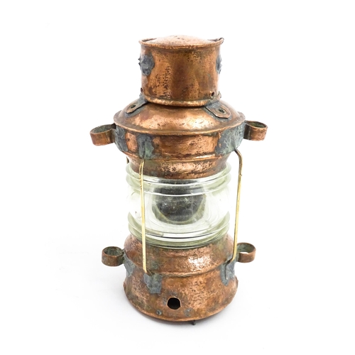 1265A - Nautical / Maritime Interest: A 20thC copper ships anchor navigation lamp / lantern. Approx. 10