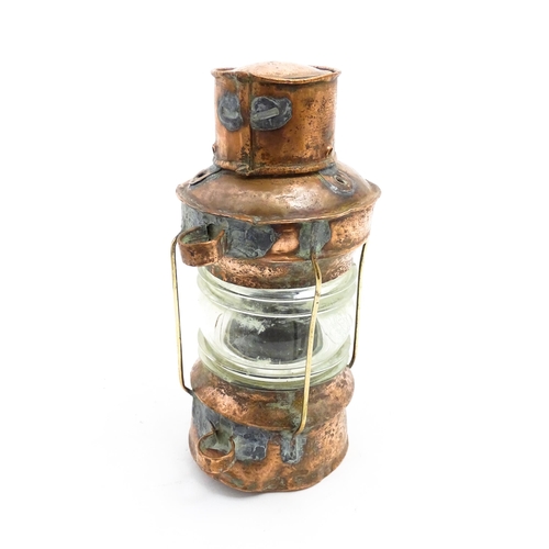 1265A - Nautical / Maritime Interest: A 20thC copper ships anchor navigation lamp / lantern. Approx. 10