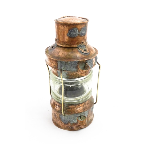 1265A - Nautical / Maritime Interest: A 20thC copper ships anchor navigation lamp / lantern. Approx. 10