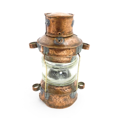 1265A - Nautical / Maritime Interest: A 20thC copper ships anchor navigation lamp / lantern. Approx. 10