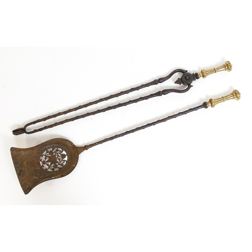 1269 - Two 20thC cast fire tools with twist detail comprising tongs and shovel. Tongs approx. 30