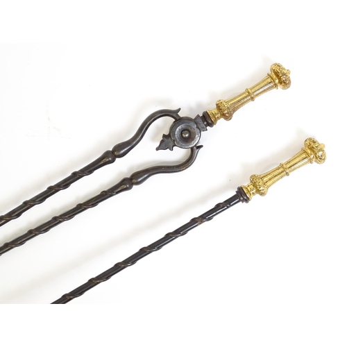 1269 - Two 20thC cast fire tools with twist detail comprising tongs and shovel. Tongs approx. 30