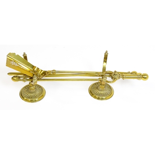 1270 - A 20thC brass fireside companion set comprising a pair of shaped stands, poker, tongs and shovel. Fi... 