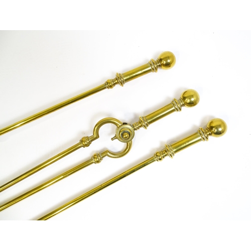 1270 - A 20thC brass fireside companion set comprising a pair of shaped stands, poker, tongs and shovel. Fi... 