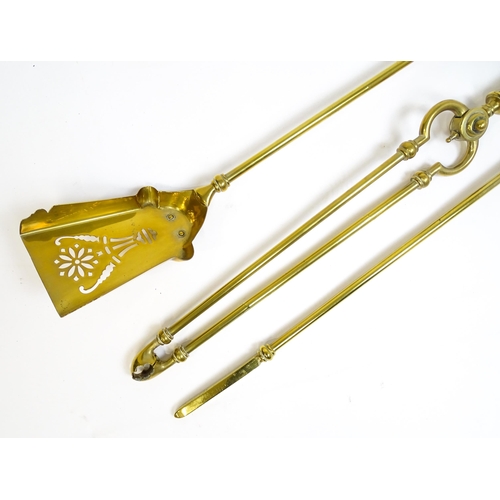 1270 - A 20thC brass fireside companion set comprising a pair of shaped stands, poker, tongs and shovel. Fi... 