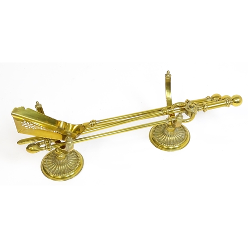 1270 - A 20thC brass fireside companion set comprising a pair of shaped stands, poker, tongs and shovel. Fi... 