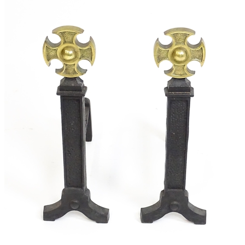 1271 - A pair of 20thC cast iron fire dogs surmounted by brass crosses. Approx. 21 1/2