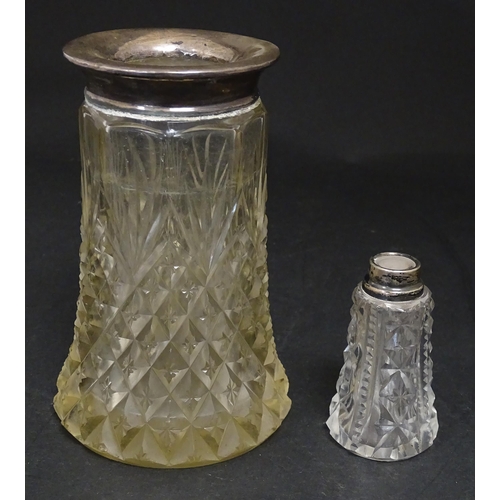 255 - A cut glass vase with silver rim hallmarked London 1920. Together with a scent bottle with silver ri... 