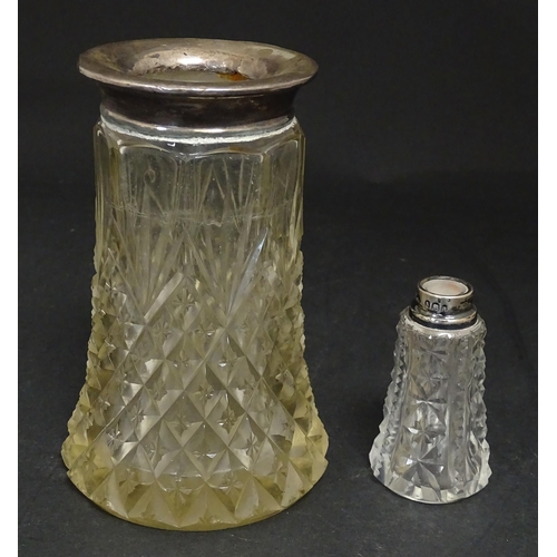 255 - A cut glass vase with silver rim hallmarked London 1920. Together with a scent bottle with silver ri... 