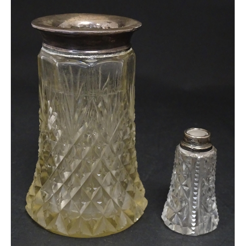 255 - A cut glass vase with silver rim hallmarked London 1920. Together with a scent bottle with silver ri... 