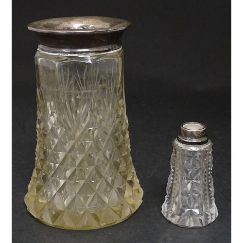 255 - A cut glass vase with silver rim hallmarked London 1920. Together with a scent bottle with silver ri... 