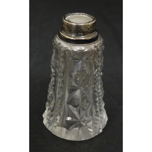 255 - A cut glass vase with silver rim hallmarked London 1920. Together with a scent bottle with silver ri... 