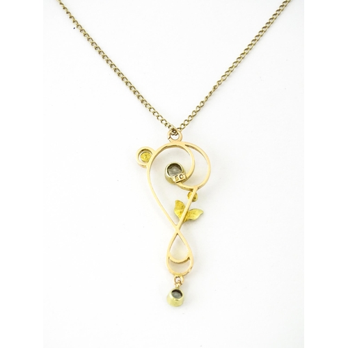 682 - A 15ct gold pendant set with aquamarines and seed pearls, on a 9ct gold chain. Pendant approx. 1 1/2... 