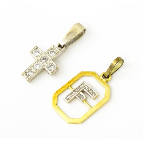 683 - An 18ct gold pendant with letter F to centre having diamond detail. Together with a cross form penda... 