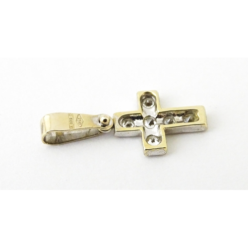 683 - An 18ct gold pendant with letter F to centre having diamond detail. Together with a cross form penda... 