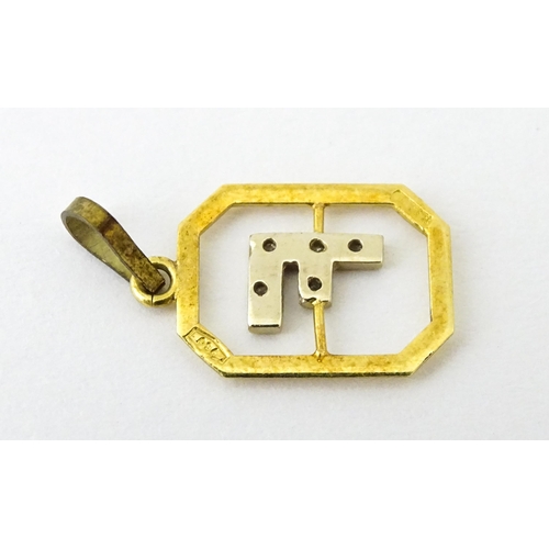 683 - An 18ct gold pendant with letter F to centre having diamond detail. Together with a cross form penda... 