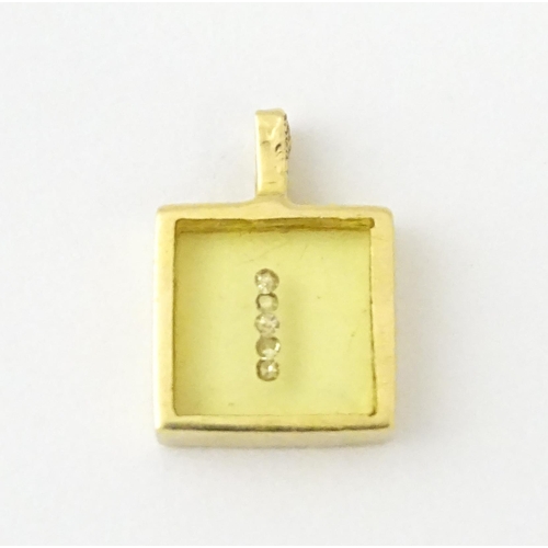 691 - An 18ct gold pendant of squared form with diamonds set to centre. Stamped Morabito. Approx. 1/2