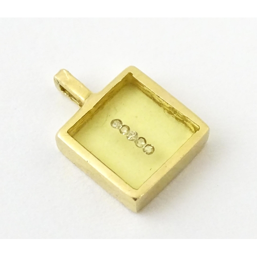 691 - An 18ct gold pendant of squared form with diamonds set to centre. Stamped Morabito. Approx. 1/2