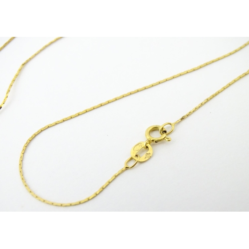 693 - A 9ct gold chain necklace. Together with another. Both approx. 16