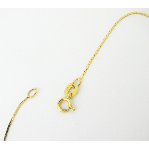 693 - A 9ct gold chain necklace. Together with another. Both approx. 16